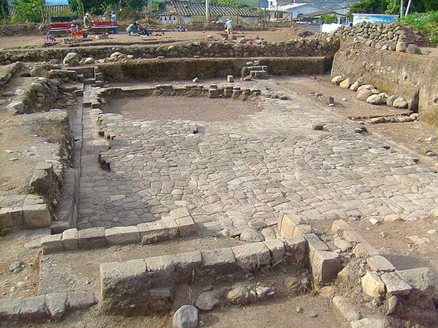 Fig. 1: Semi-subterranean temple comprising central feature of religious-ceremonial precinct of Inca-Caranqui at eastern end of municipal lot looking to north. Note the two separate flooring episodes in evidence, the baffled, step-down entryways in NE and NW corners of temple (mirroring the SE and SW corners), and the covered exit canal located at center-east side of floor (right side of photo). The large void at the north end of floor was found as is in the 2006 excavations and may represent a Colonial period removal event.